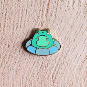 Staying Afloat Frog Enamel Pin